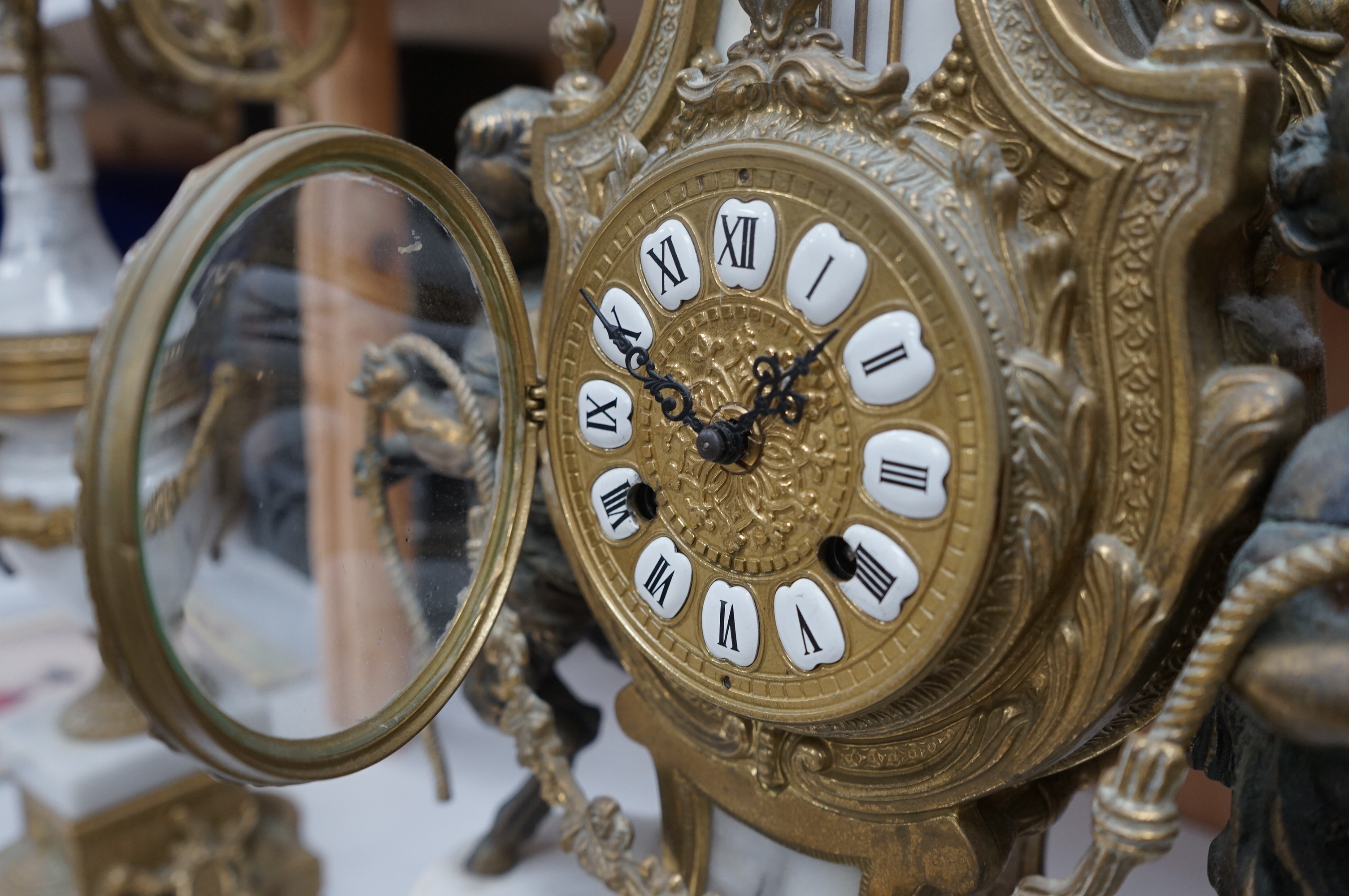 A gilt metal and marble clock garniture, with key, 61cm. Condition - fair/good